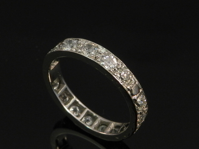 A platinum mounted old cut diamond full eternity ring