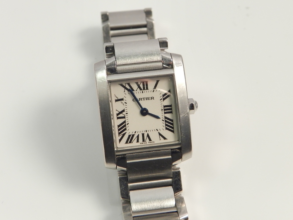 A ladies stainless steel cased Cartier Tank wristwatch with box