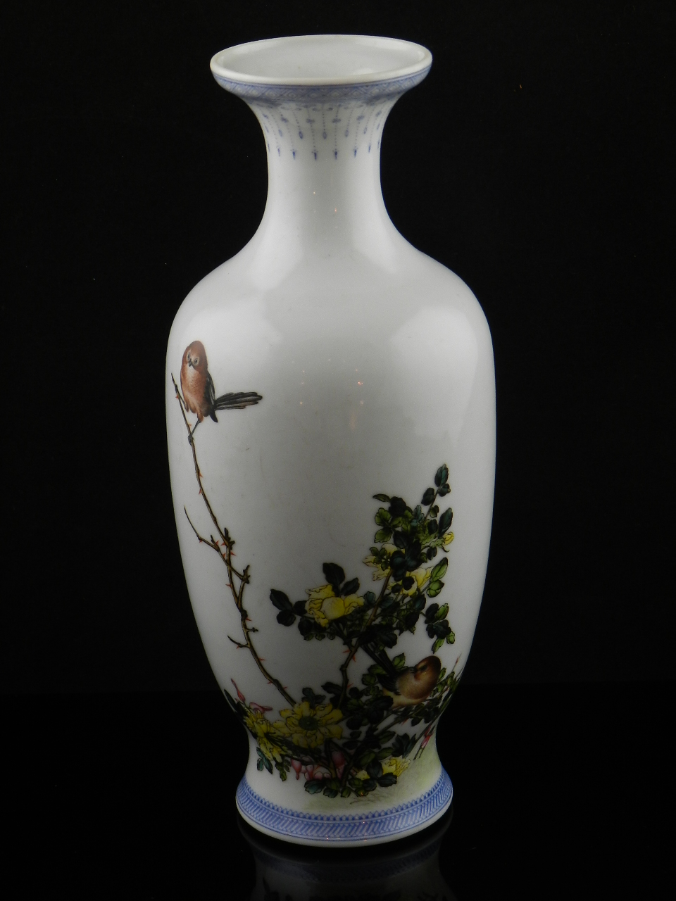 A Chinese Republic porcelain vase decorated with birds on a flowering sprig bearing four character