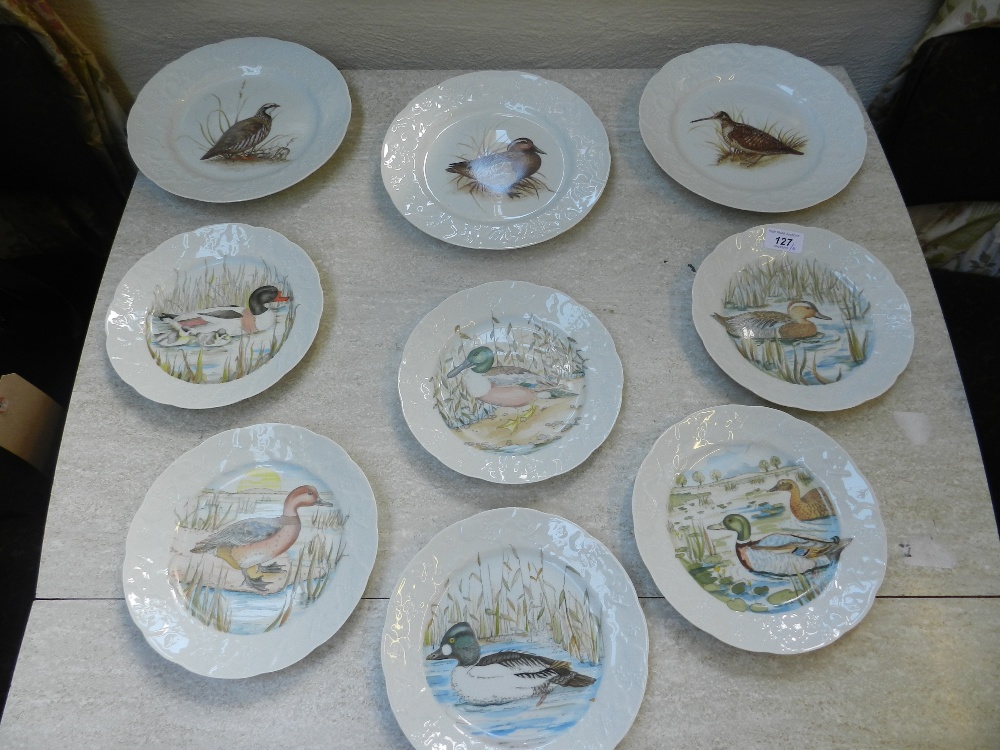 A set of six lierre sauvage porcelain plates decorated with various birds, and three larger `