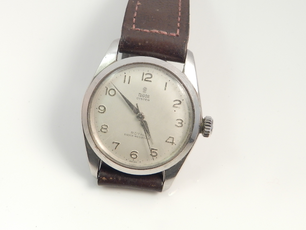 A tudor Rolex gentleman`s stainless steel cased wristwatch set in a tan leather strap.