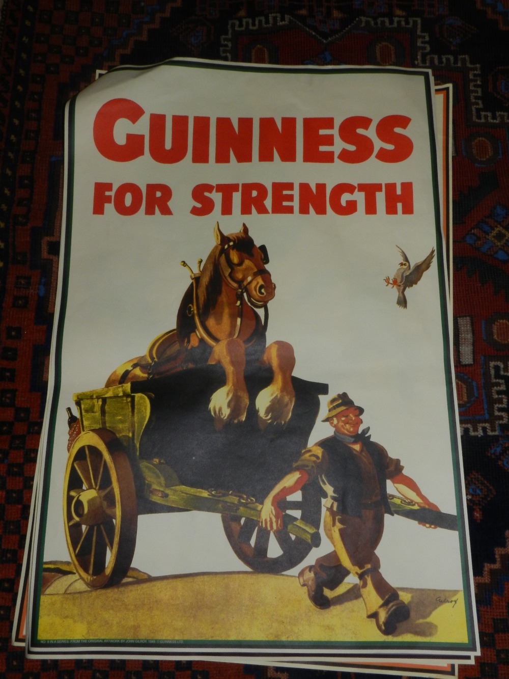 Three various Guiness advertising posters.