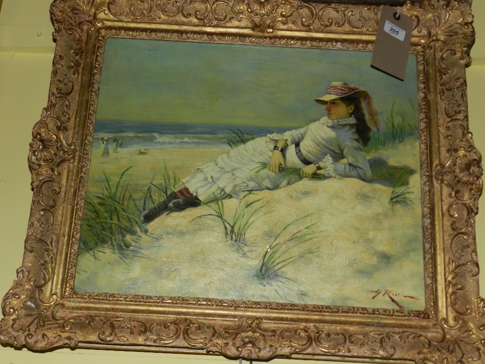 A framed oil on board of a reclining female on the beach in Edwardian clothing, signed bottom