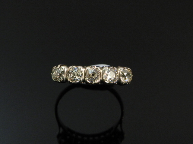 A five stone diamond mounted lady`s platinum dress ring.