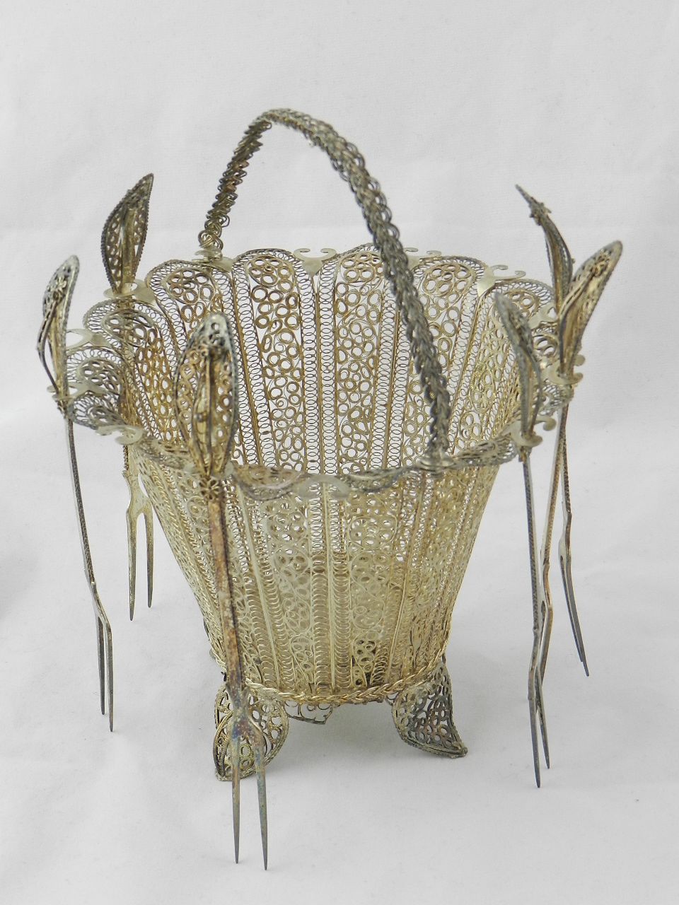 A continental 800 silver figure work basket and six matching forks