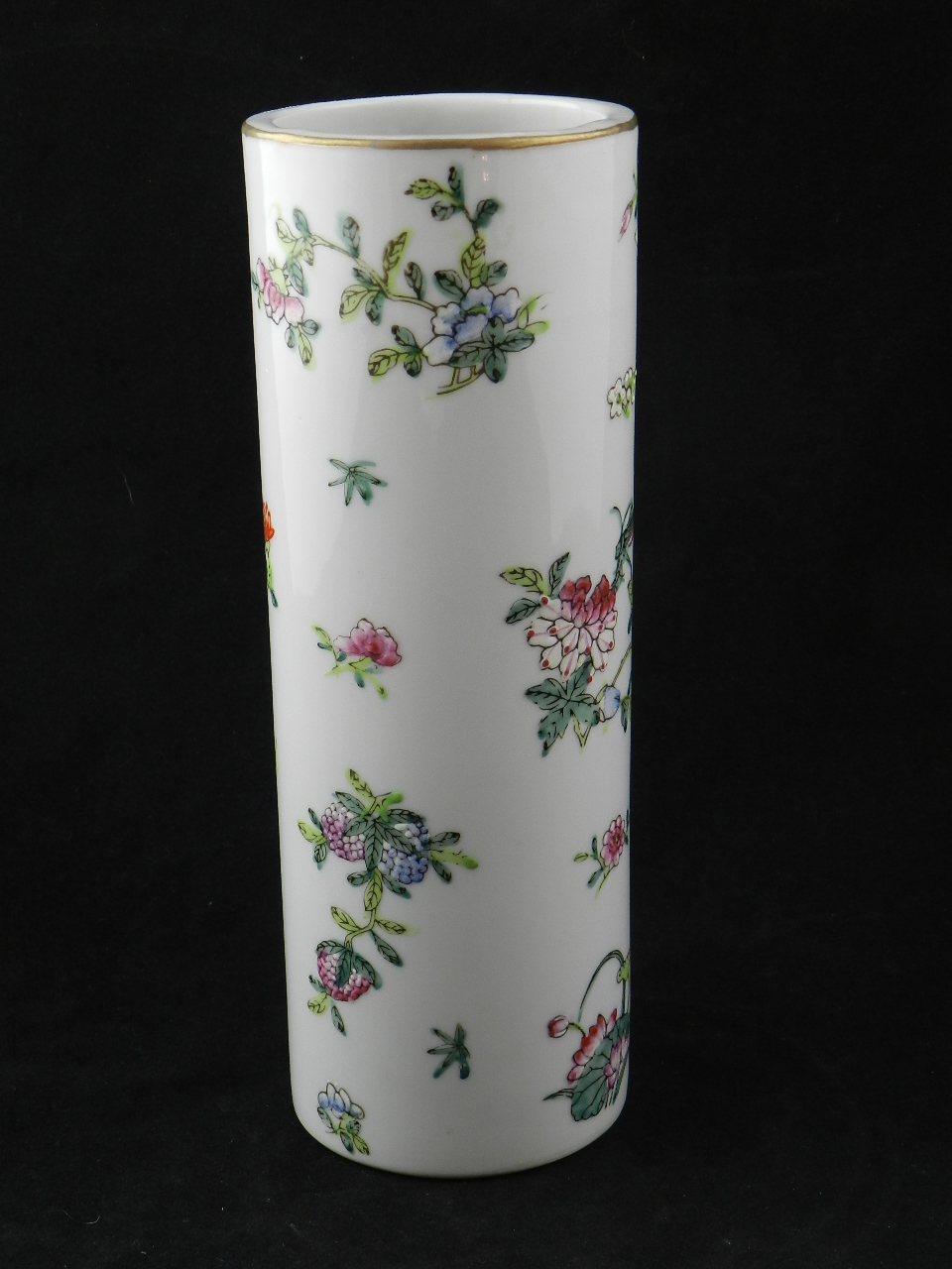 A Chinese republican vase of tubular form decorated with insects and sprays of flowers and leaves.