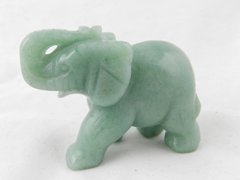 A carved green jade elephant.