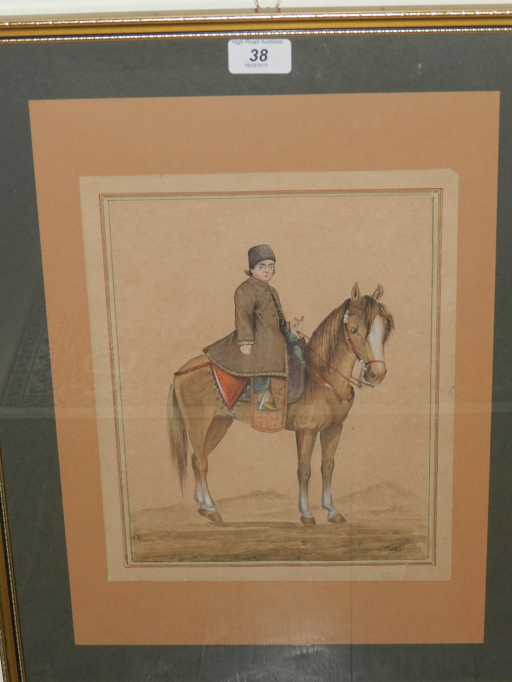 A framed watercolour of Shah Abbas as a boy on horseback.