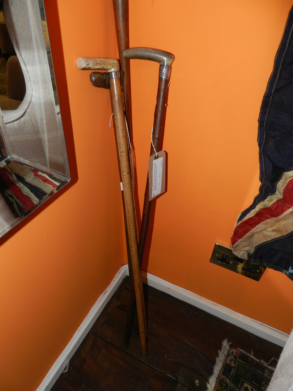 Four various walking canes, to include; two horn handled Turkish with silver mount and one other