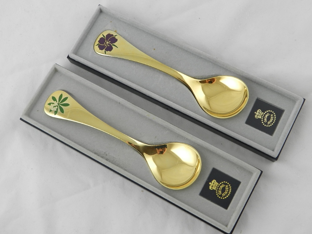 Two cased silver gilt Georg Jenson spoons.