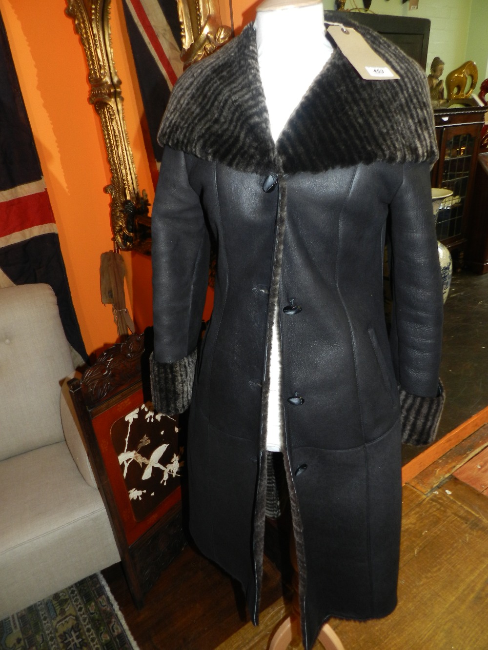 A "Furmod," dark chocolate striped sheepskin coat with hood.