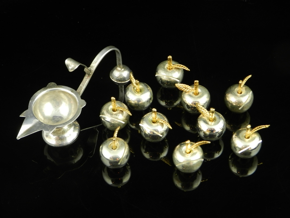 An attractive set of ten novelty silver plated menu holders in the form of apples with gilded detail