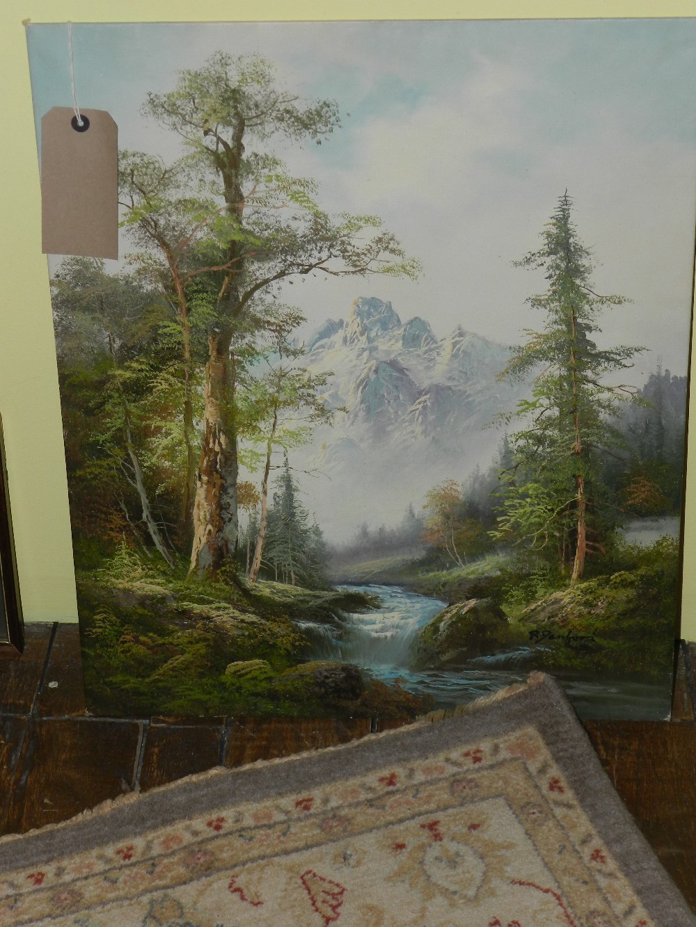 An oil on board of a river and mountain scene signed bottom right by the Canadian artist R. Danford.