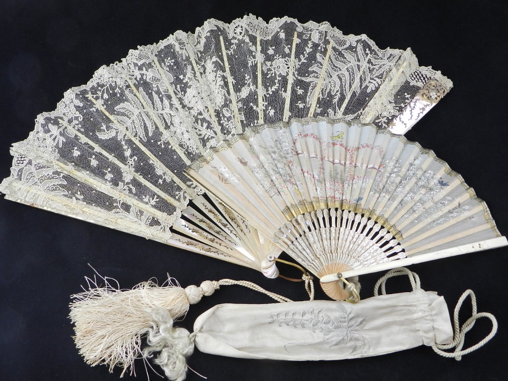 A Victorian inlaid Mother of pearl and lace fan with box together with a similar silk fan of the