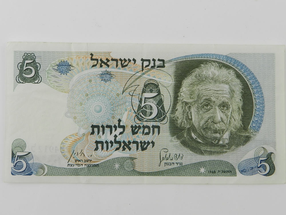 An Israeli 1968, five shekel banknote depicting "Albert Einstein," in an individual plastic wallet.