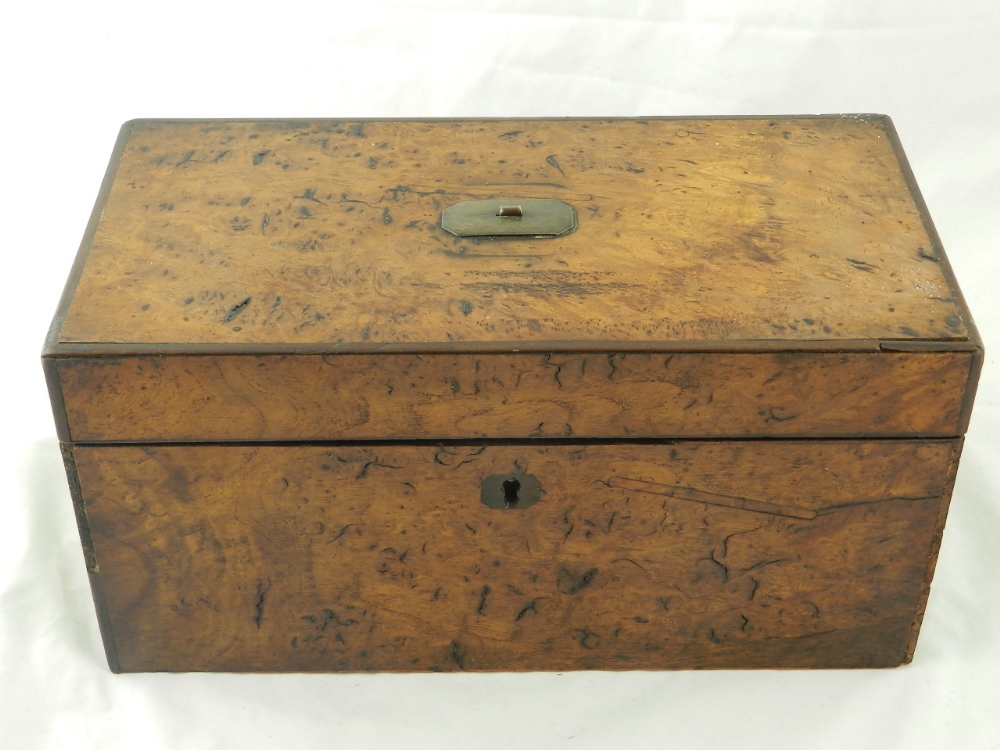 A Georgian burr walnut two section tea caddy, the hinged cover revealing two hinged compartments and