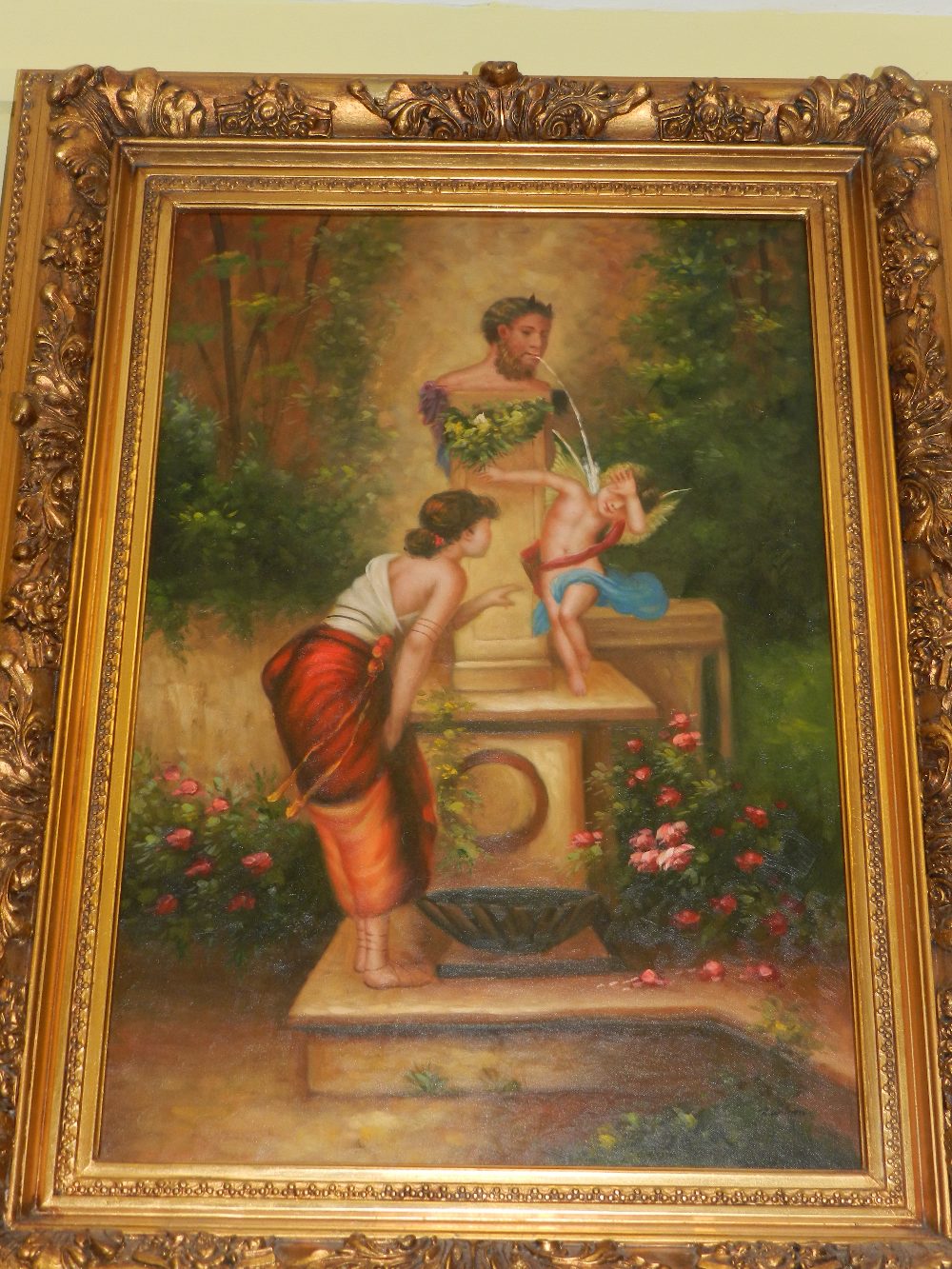 An oil on canvas of figures and a classical fountain set in an ornate gilt frame.