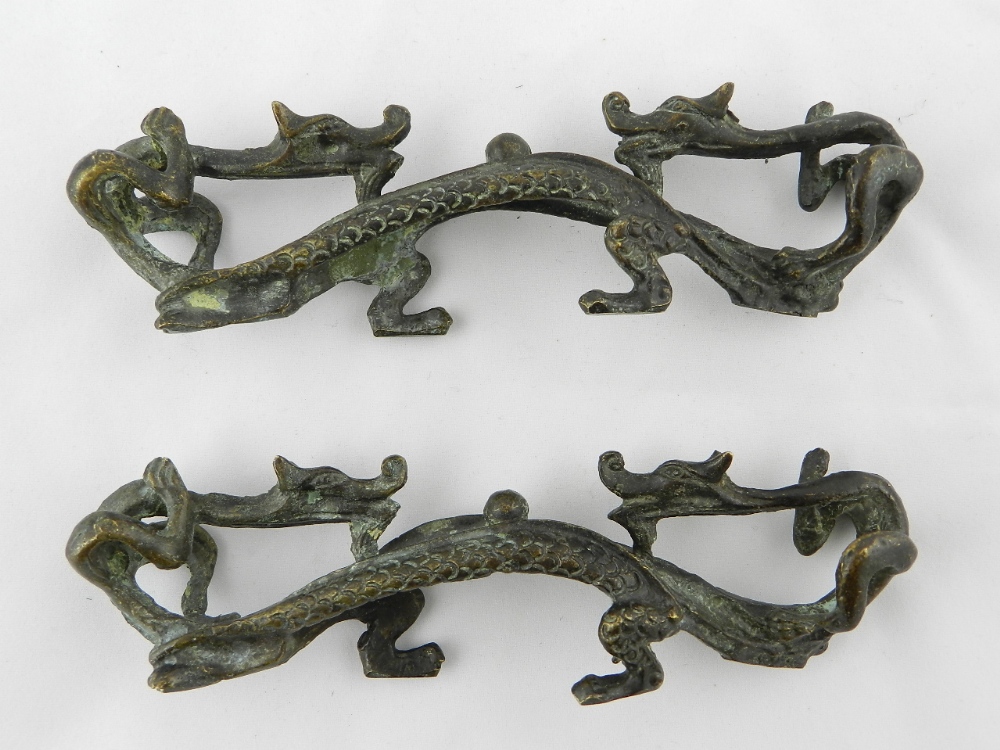 A pair of Chinese cast bronze dragon pen holders