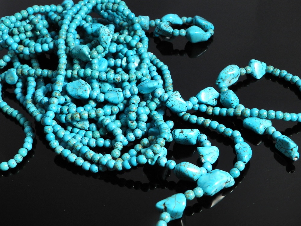 Four strands of turquoise beads in Art Deco style