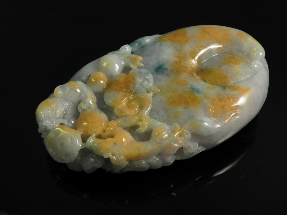 A Chinese natural colour jade carving of a dragon