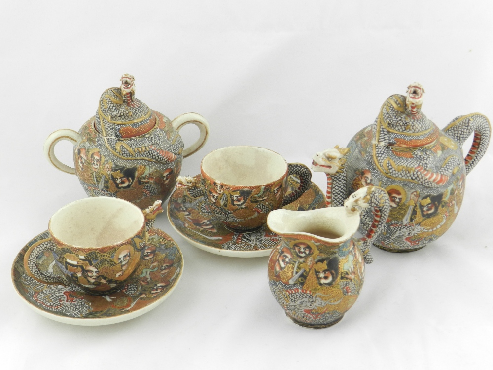 A late 19th century Japanese meiji period five piece satsuma teaset comprising of a teapot, sugar