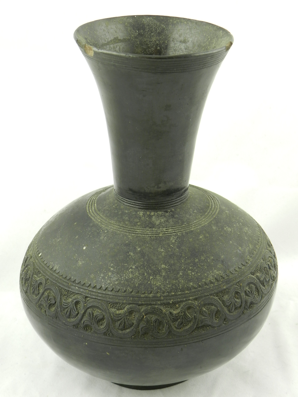 A middle eastern ceramic vase of compressed spherical form with funnel shaped neck on rim foot,