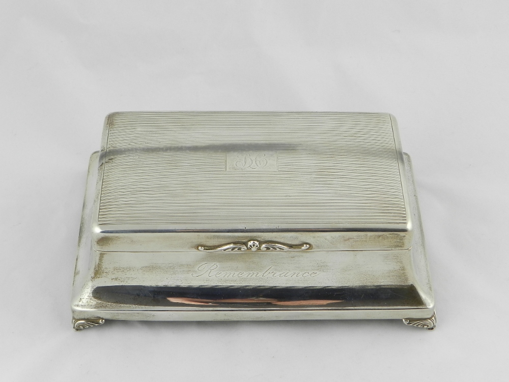 A sterling silver cigarette/jewellery casket Birmingham 1931 having an out swept skirt and set in