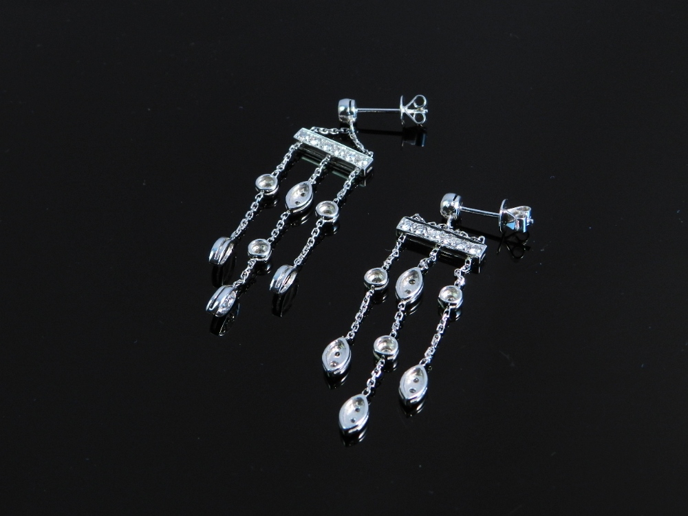 A pair of chandelier 18ct white gold earrings set with brilliant cut diamonds.