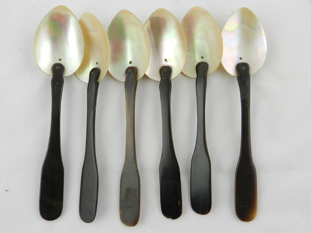 Six Turkish dessert spoons with horn handles and mother of pearl bowls.