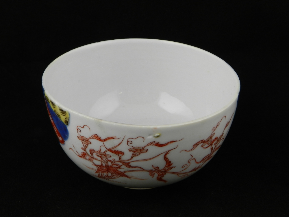 A Japanese late 18th century elegant decorated bowl with scrolling foliage, wildlife and two