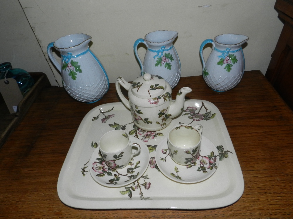 Victorian floral cabaret set along with three graduated pearl ware jugs decorated with flowers and