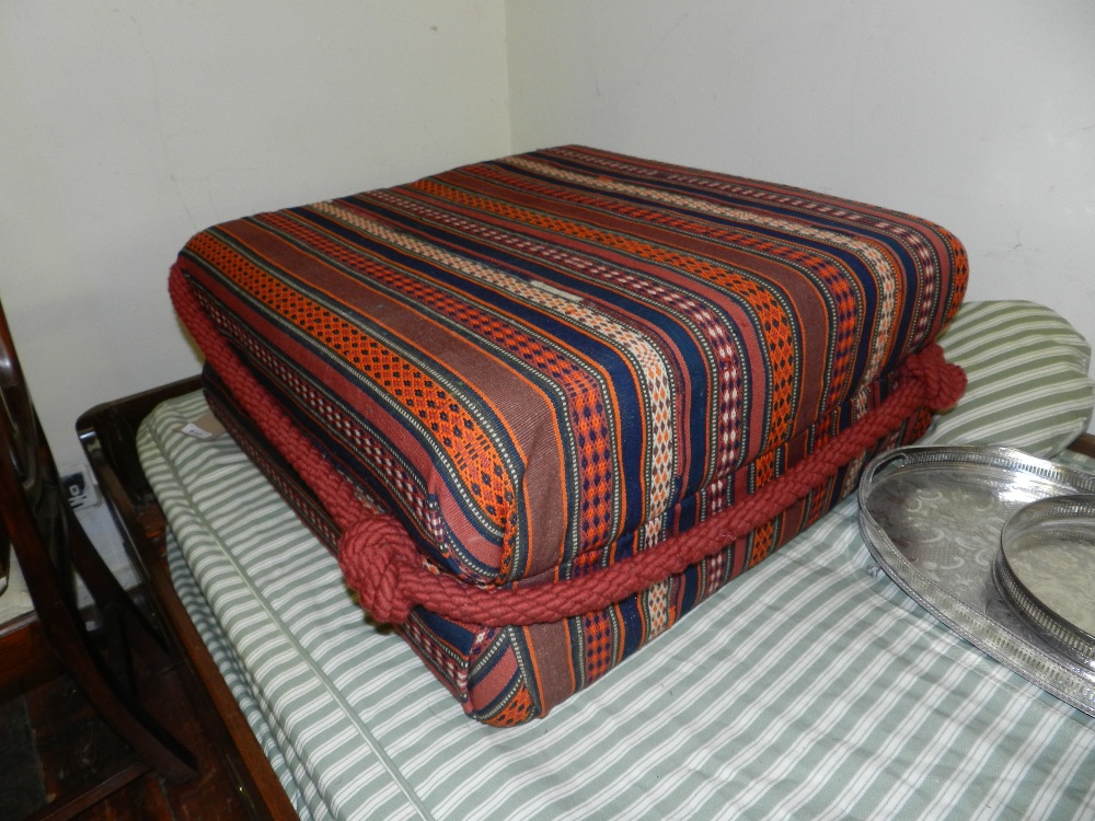A Persian kelim upholstered footstool