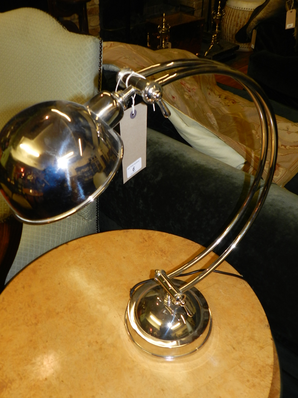 An Art Deco style nickel plated adjustable lamp of Arc form having domed shade