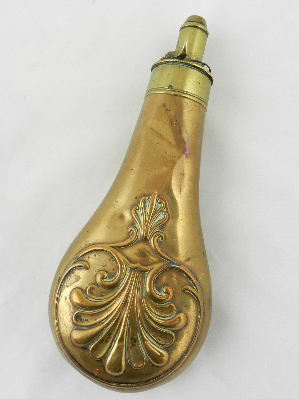 A 19th century G.W & J Hawksley copper and brass powder flask with embossed design.