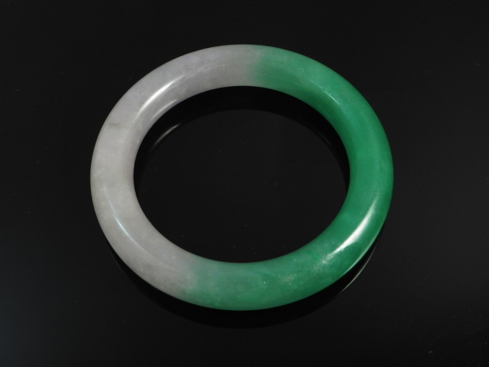 A Chinese green jade bangle