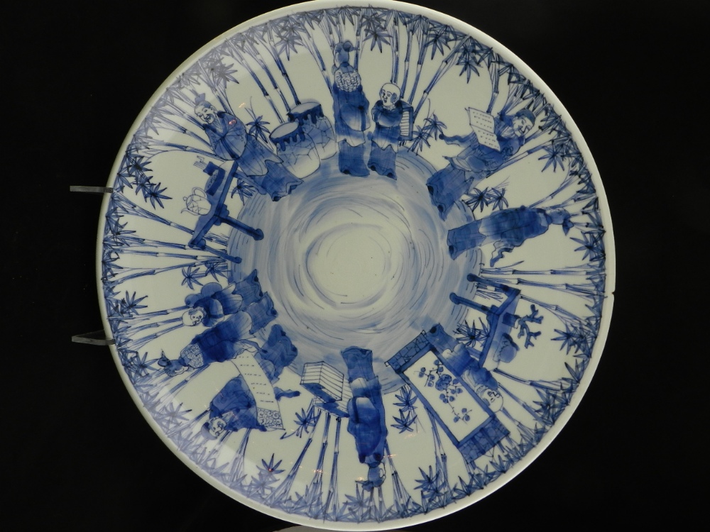 A 19th century or possibly earlier Chinese blue and white large charger (length 45.5cm) decorated