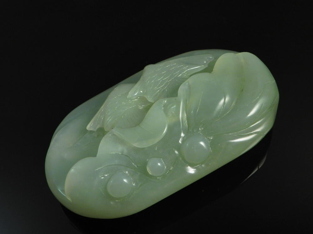 A Chinese celadon jade carved with fish