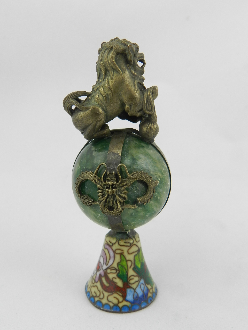 A Chinese green jade and clossorie paperweight mounted with a bronzed dog of Fo.