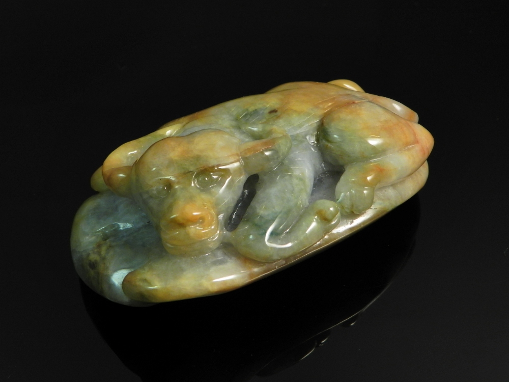 A Chinese natural coloured jade carved with a water buffalo.