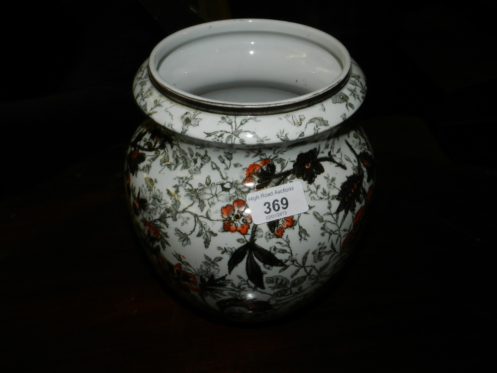 A Lugwig Wessel porcelain vase decorated with enriched floral designs