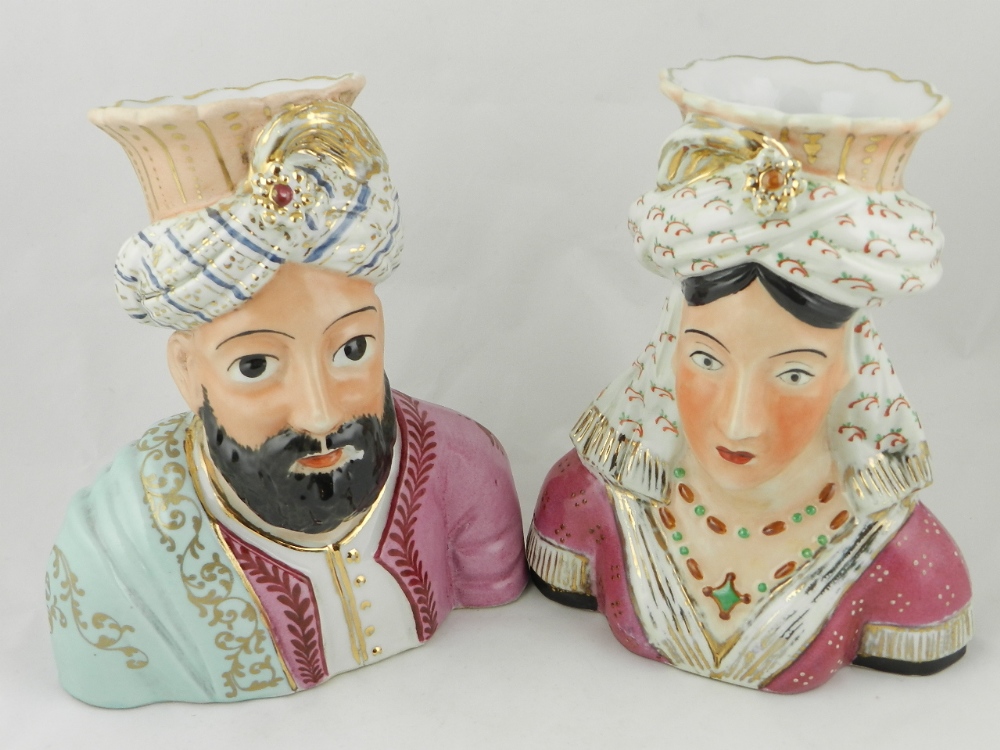 A pair of French ceramic figures of an Ottoman sultan and his wife in the form of vases with gilt