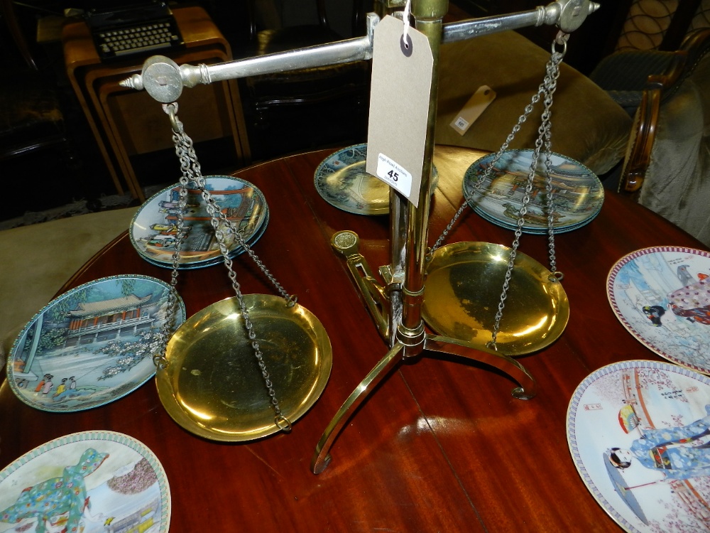 A vintage set of brass balance scales stamped Doyle and Sons.