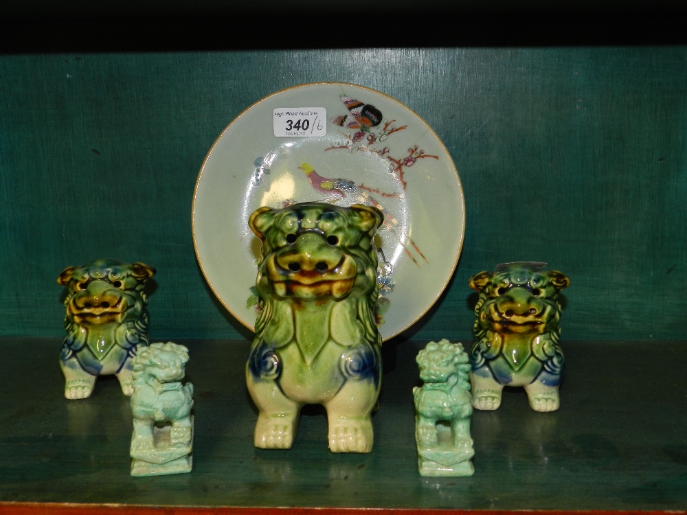 A 19th century Chinese Famille Vert plate decorated with birds and butterflies, a green glazed dog