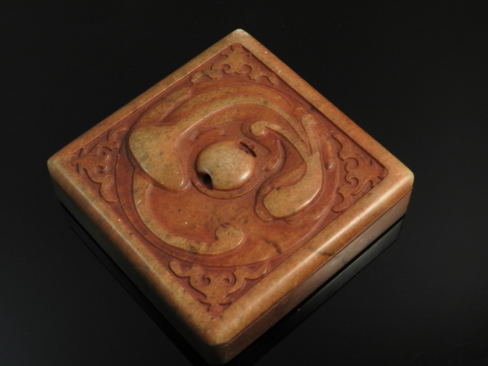 A Chinese soapstone seal having carved salamander decoration.