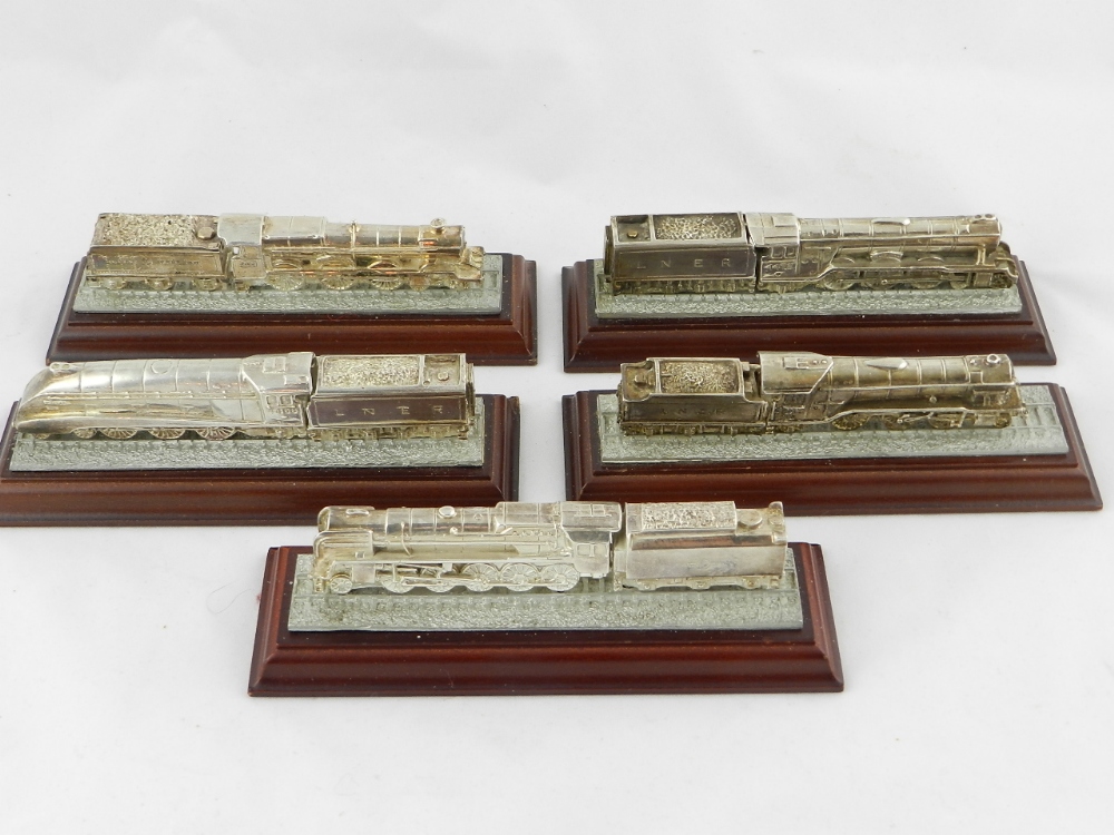 A collection of five well detailed gold painted metal models of steam trains,LNER,Great Western