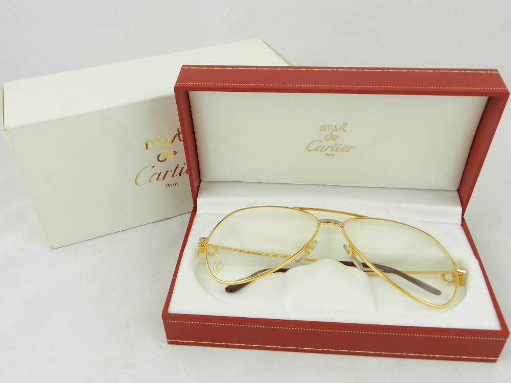 A vintage pair of Must De Cartier aviator glasses. (boxed and as new)