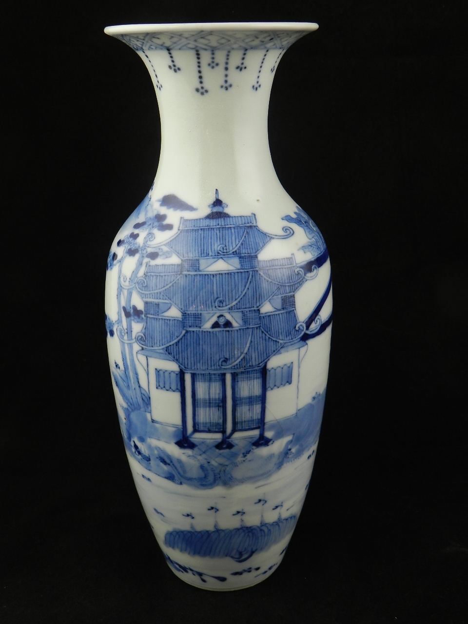 A 19th century Chinese blue and white slim baluster shape vase with everted rim decorated all