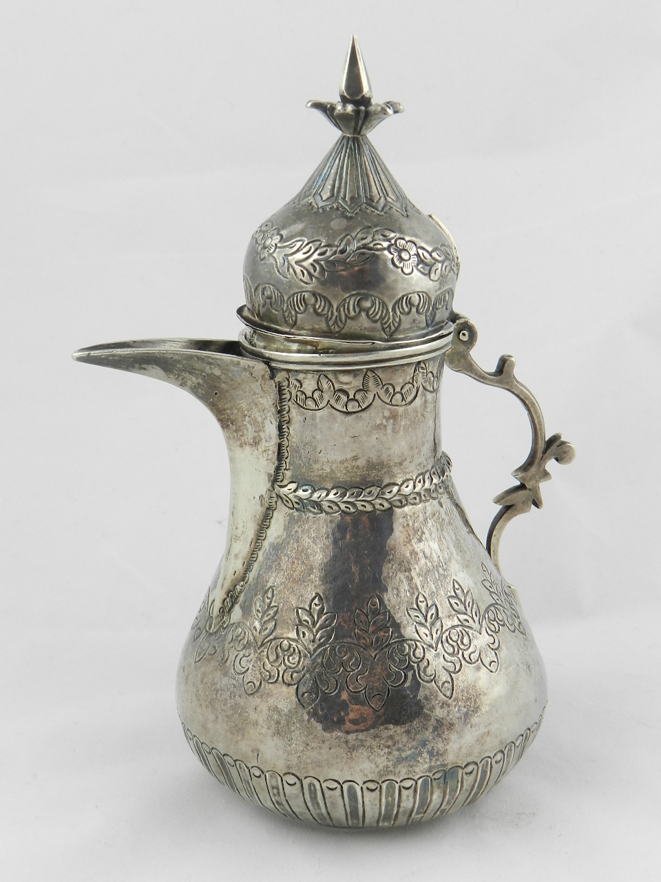 A 19th century Ottoman silver coffee pot with Tugra; part fluted and chased with a band of leaves