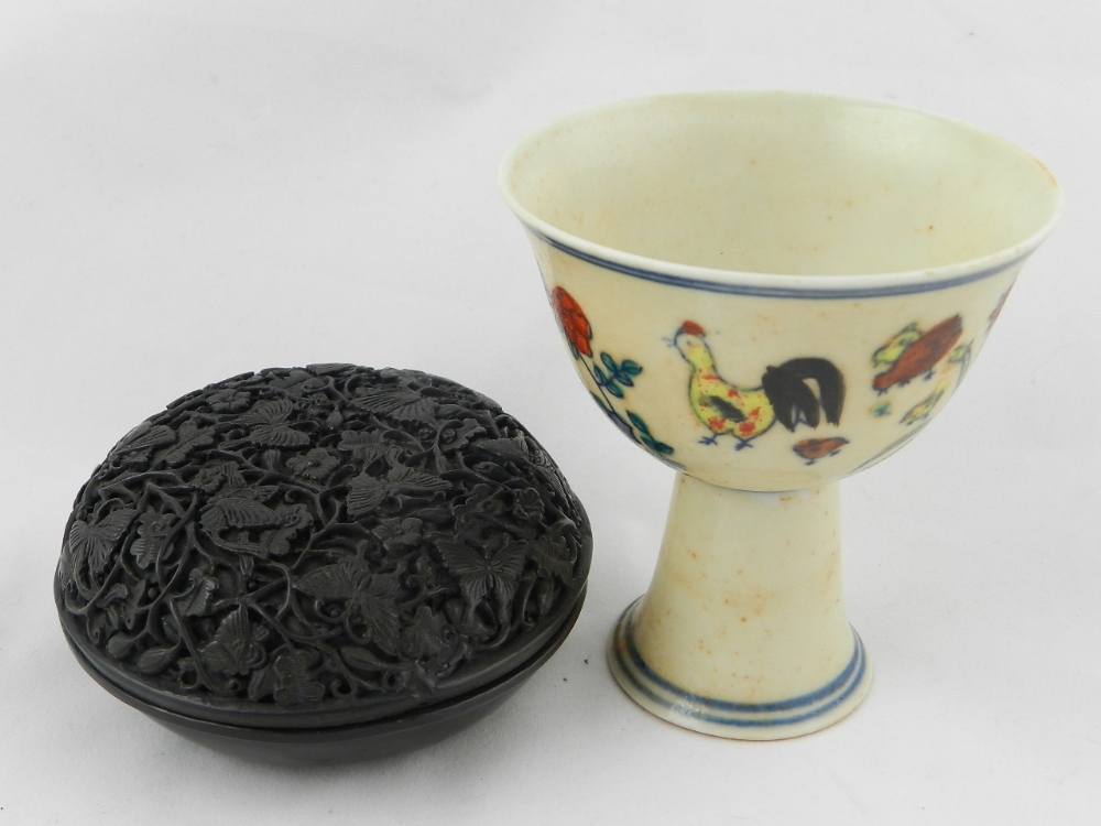 A Chinese hand painted bowl on stand along with a black lacquer pot and cover.