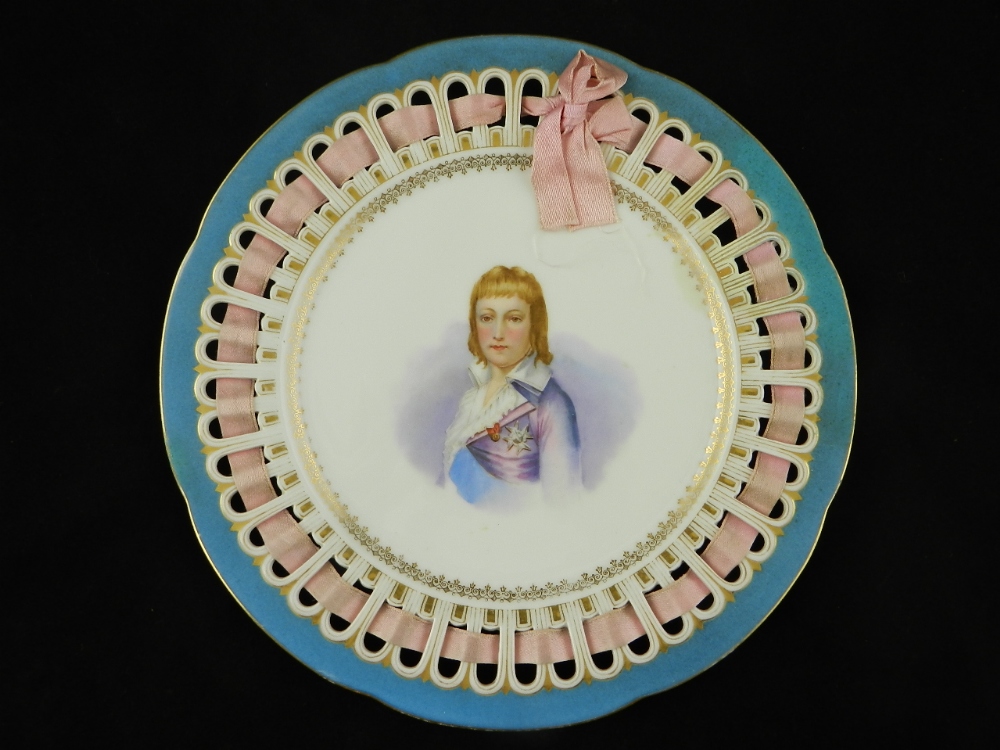 A 19th century, Coalport Sevres ribbon plate with central portrait.